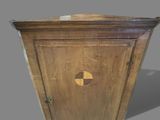 a wooden cabinet with a mirror on the door