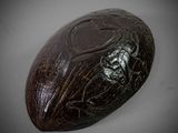 an image of a wooden object with a skull on it