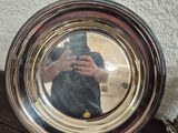 a man taking a picture of himself in a mirror