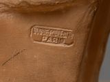 a close up of a clay vase with a label on it