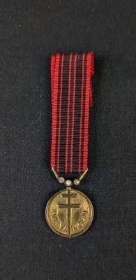 an image of a medal with a cross on it
