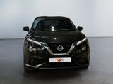 the front view of a black nissan suv parked in a showroom