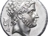 a close up of a coin with a man ' s head on it