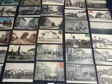 a bunch of old postcards are sitting on a table
