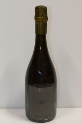 a bottle of wine that is sitting on a table