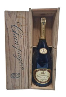 a wooden box with a bottle of wine inside of it