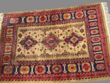 a close up of a rug on a table with a gray background