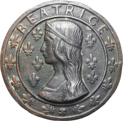 a close up of a coin with a woman ' s face on it