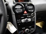 a car dashboard with a digital clock on it