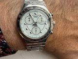 a man that is wearing a watch on his wrist