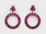 a pair of ruby and diamond earrings