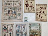 many books on the table with pictures of people on them
