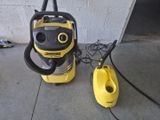 the yellow and black vacuum cleaner is next to a yellow and black vacuum