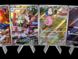 cinq cartes Pokémon différentes alignées sur un fond noir
