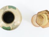 two vases that are sitting next to each other on a table