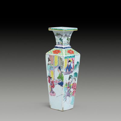a vase that has a picture of people on it