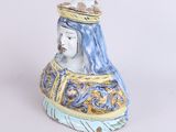 a figurine of a woman with a crown on her head
