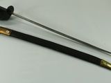 a black and gold pen and a black and gold pen on a white surface