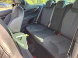 four seats in the back of a car that are empty