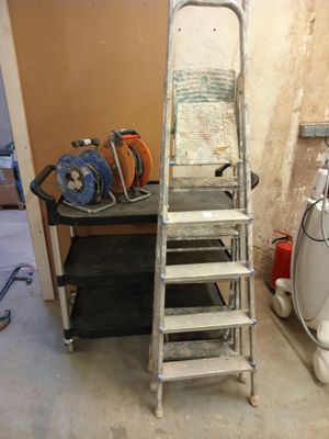 a ladder that is leaning against a wall in a room