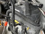 an image of a vacuum and other tools in a garage