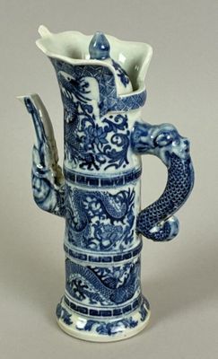 a blue and white vase with a dragon on it