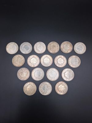 a close up of a heart made out of coins on a black surface