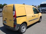 a yellow van that is parked in a parking lot