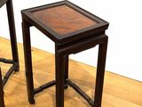 two tables that are sitting on the floor next to each other