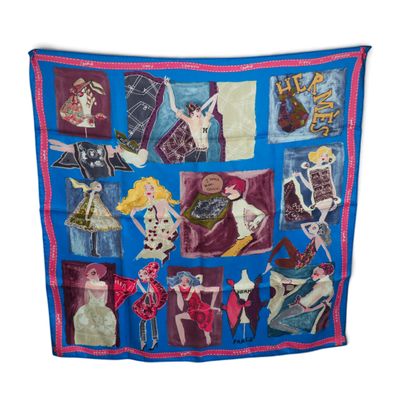 une image représentant une écharpe bleue ornée d'un motif représentant des femmes