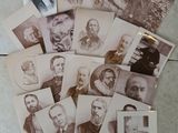 several old photographs of men and women are arranged on a table