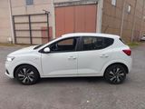 a picture of a white car parked in front of a building