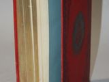 a book with a red cover sitting on a white surface