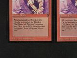 these are two cards from a card game with a picture of a man on one of them