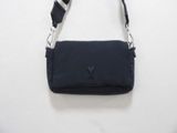 navy blue cross body bag with black strap and heart logo