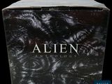an image of a box of alien anthology books on a black background