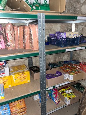 a shelf full of food and snacks in a store
