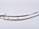 a close up of two swords on a white surface