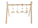 a wooden frame with a baby ' s toy hanging on it