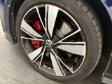 a close up of a tire on a blue car