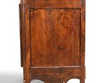 an old wooden cabinet with a door and a drawer on top of it