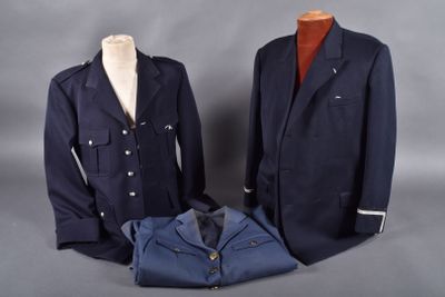 two men ' s jackets and a shirt on a mannequin stand
