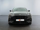 the front view of a black ford fiesta parked in a white room