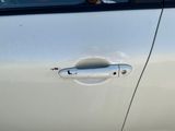 a car door handle that has a hole in it