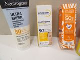 many sunscreens and sunscreen creams on the counter
