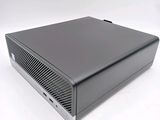 an image of a black computer sitting on top of a white surface