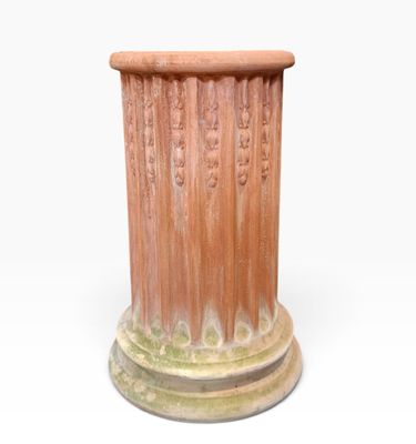 a close up of a vase on a white surface with a white background