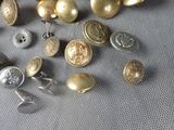 many different types of buttons that are on a table