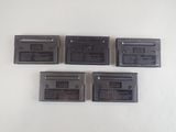 four nintendo game cartridges sitting on top of each other on a table