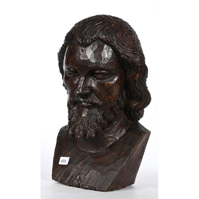 buste en bois représentant un homme aux cheveux longs et à la barbe fournie